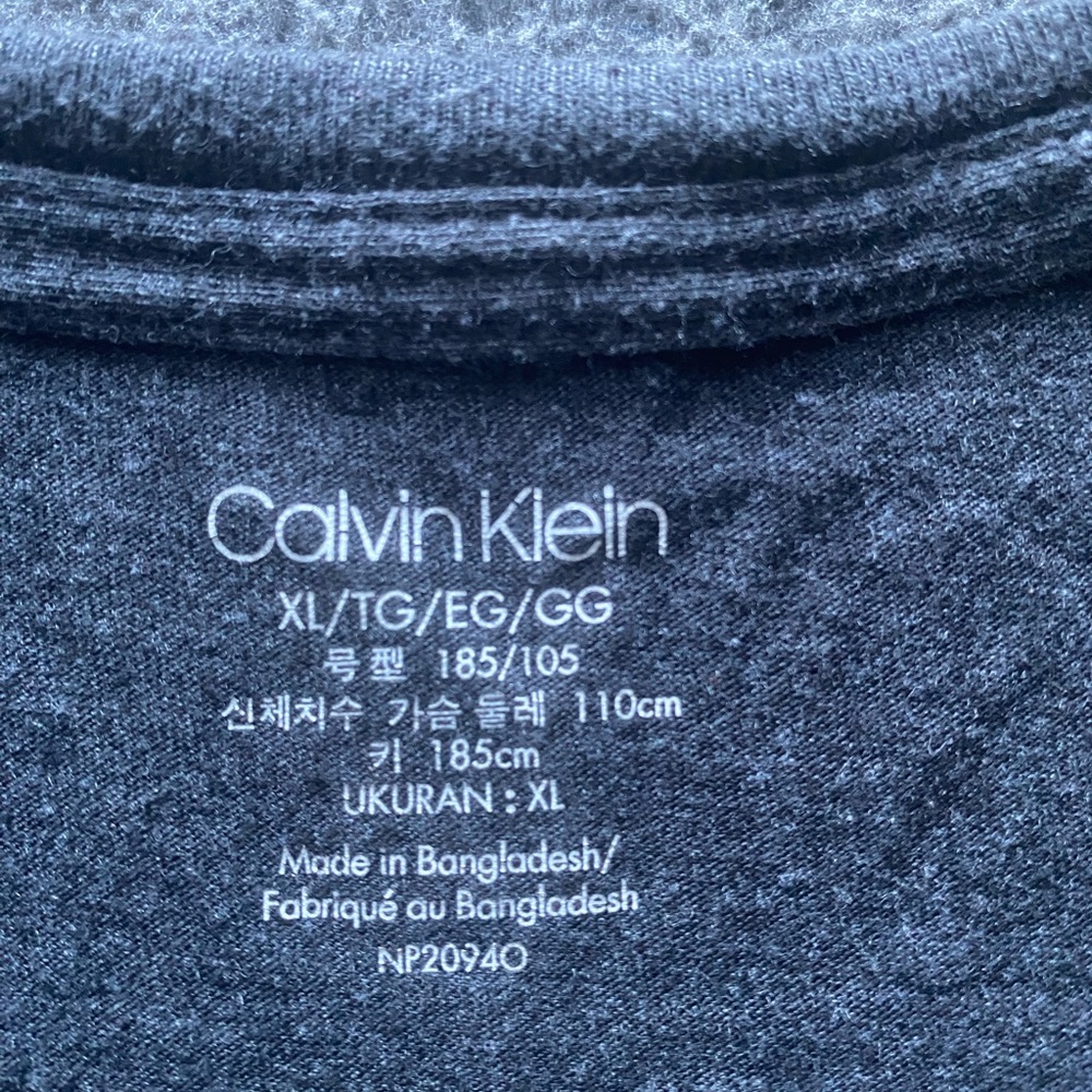 Gray long sleeve Calvin Klein tee shirt.